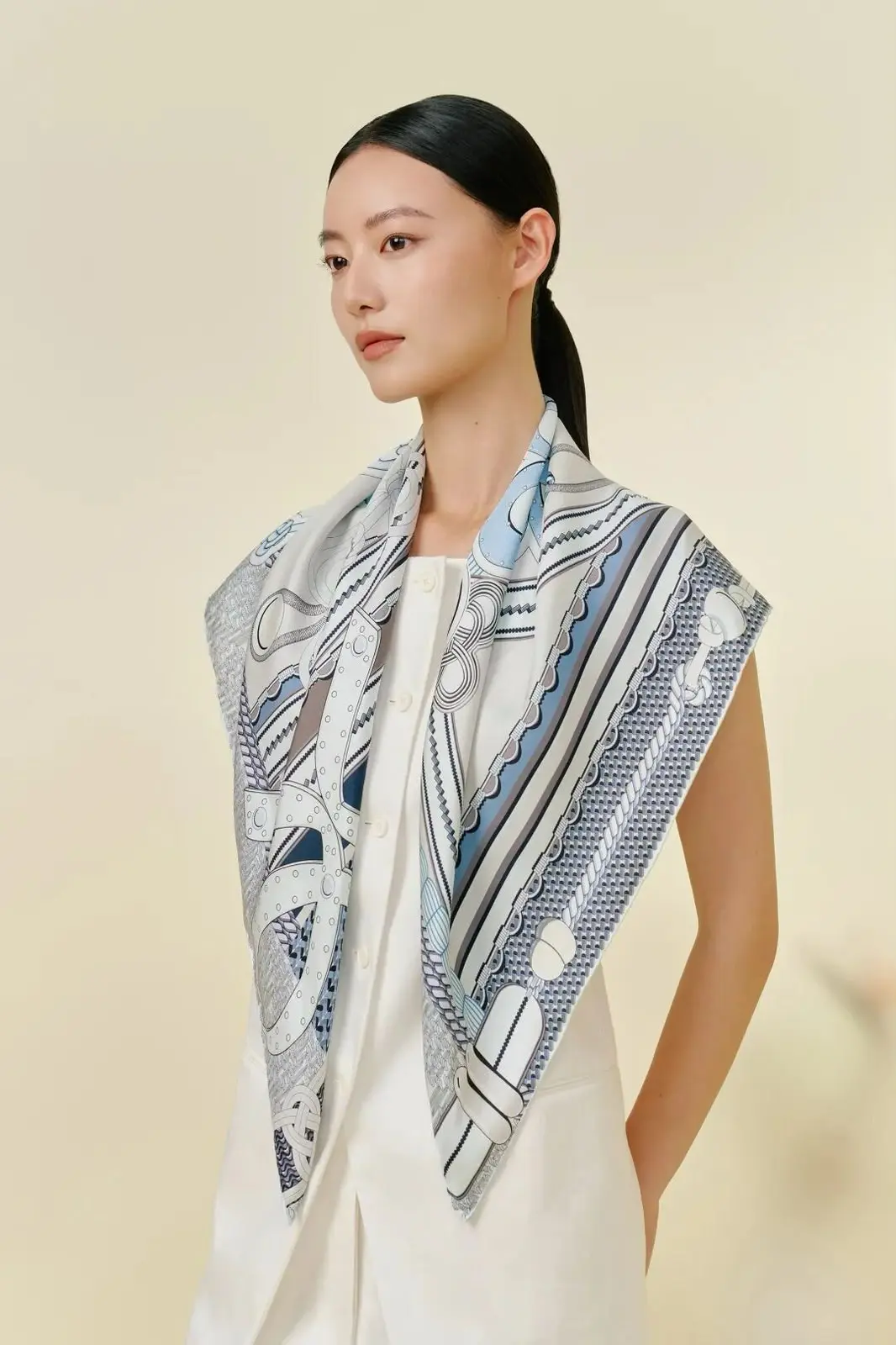 Model wearing the L’Atelier silk scarf