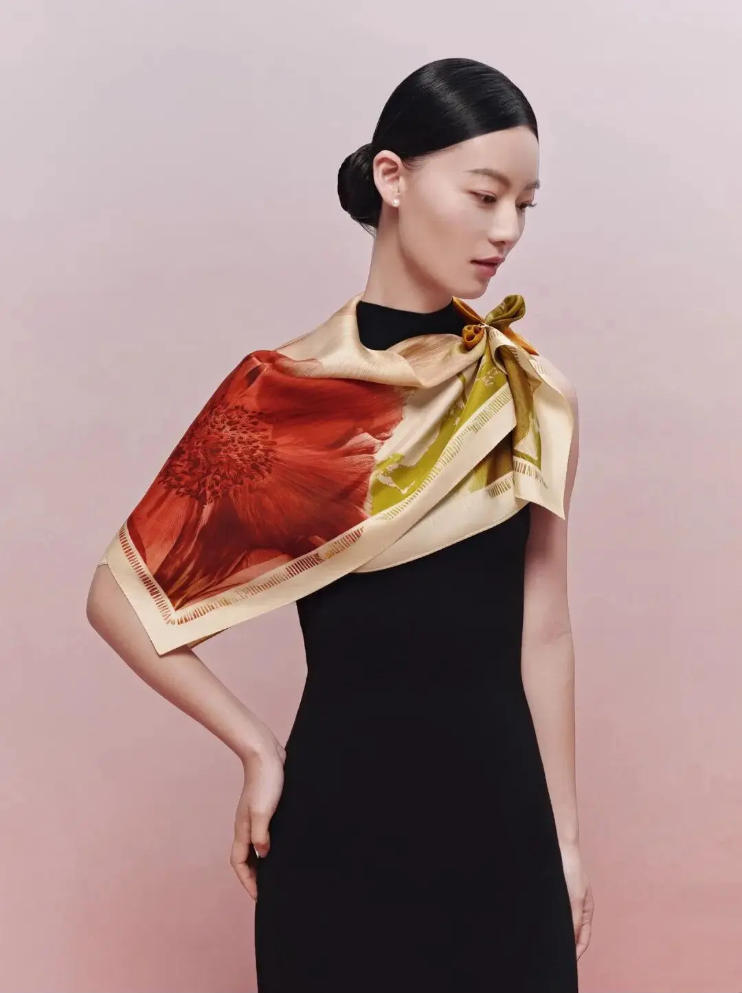 Model wearing the Les Camélias — Olive silk scarf