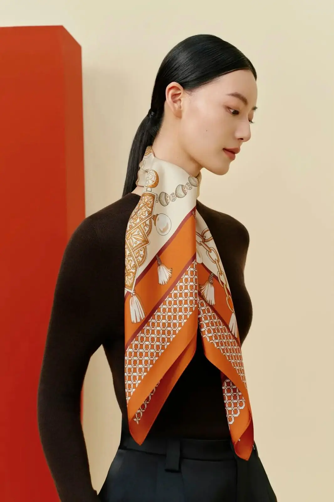 Model wearing the Les Trésors — Orange silk scarf